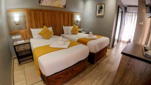 Postel nebo postele na pokoji v ubytování Starlight Inn