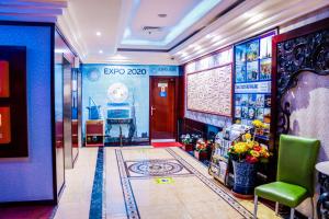 a lobby of a hotel with a door and a room at Phoenix Hotel in Dubai