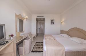 Letto o letti in una camera di Abou Sofiane Hotel