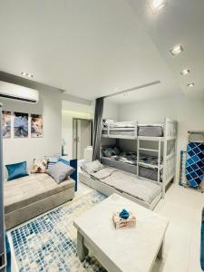 a living room with bunk beds and a table at Luxury Studio House 589-2 in 6th Of October