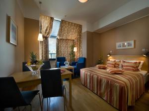 Postel nebo postele na pokoji v ubytování EA Hotel Julis