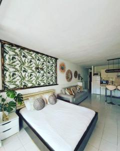 a bedroom with a large bed in a room at Tropical garden view with pool in Costa Del Silencio