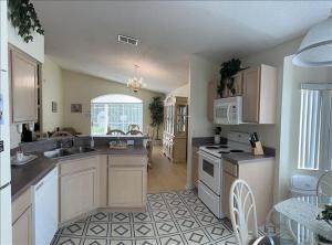 a kitchen with a sink and a stove top oven at 34 Thousand House in Davenport