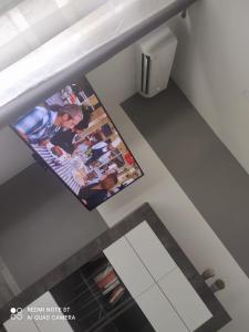 an overhead view of a bathroom with a tv on the wall at CASETTA DEL SARACENO in Roccalumera