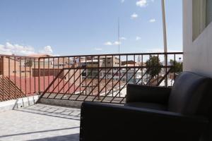 a balcony with a view of a building at Expresso Hostel in Sucre