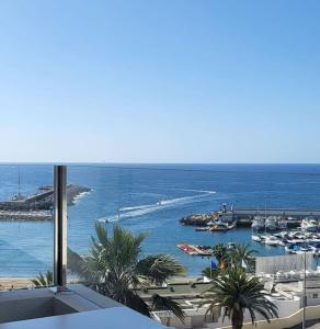 a view of a harbor with boats in the water at Golden Sunny View Apartment in Puerto Rico de Gran Canaria