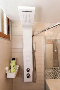 a shower with a glass door in a bathroom at Golden Sunny View Apartment in Puerto Rico de Gran Canaria