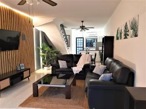 a living room with a couch and a table at Royal Lovely Apartment! in Paphos City