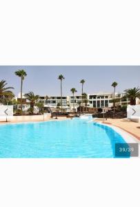 a picture of a swimming pool in a resort at Unique, Stylish & Calm Los Peces by the Sea in Costa Teguise