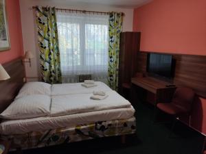 Katil atau katil-katil dalam bilik di Hotel Formanka