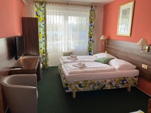 Katil atau katil-katil dalam bilik di Hotel Formanka