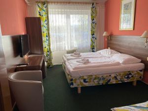 Katil atau katil-katil dalam bilik di Hotel Formanka