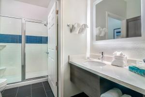 a bathroom with a sink and a shower at Staybridge Suites Tyler University Area, an IHG Hotel in Tyler