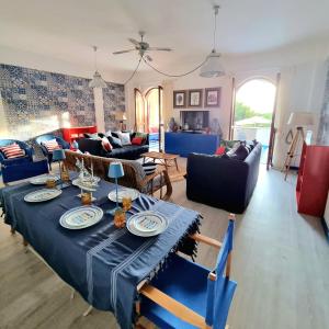 a living room with a table with plates on it at VISTA MARE Su tre piani con giardino in Falerna