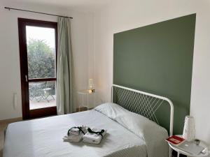 A bed or beds in a room at Aquilone Garden