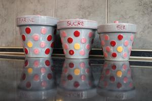 four polka dot cups sitting on a counter at Siesta in Kikinda
