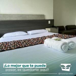 Postel nebo postele na pokoji v ubytování Hotel Prada