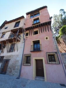 a tall building with aventhventhventhventhventhventhventhventhventhventhventh at Los Ojos de la Mora Apartamentos Boutique in Cuenca