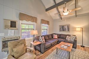 a living room with a couch and a table at Pristine Cabin Less Than 2 Mi to Beech Mountain Resort! in Beech Mountain