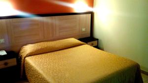 Postel nebo postele na pokoji v ubytování Hotel Giardino