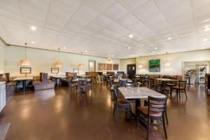 a dining room with tables and chairs in a building at Best Western Mountain Lodge At Banner Elk in Banner Elk