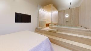 TV a/nebo společenská místnost v ubytování Carletta's Aparta-Suite & Spa