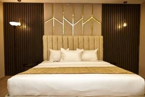 Postel nebo postele na pokoji v ubytování Mayfair Hotel Wuse2 Abuja