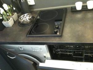 a stove top oven in a kitchen next to a counter at Home Sweet Home Claridge 1bedroom in Paris