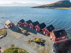 a row of houses on an island in the water at 6 person holiday home in Brekstad-By Traum in Brekstad