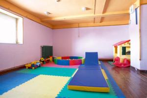 a play room with many different types of play equipment at Alberg Núria Xanascat in Queralbs