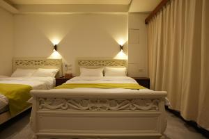 Postel nebo postele na pokoji v ubytování Lemuju B&B Hotel