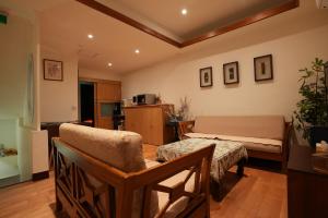 Posezení v ubytování Lemuju B&B Hotel