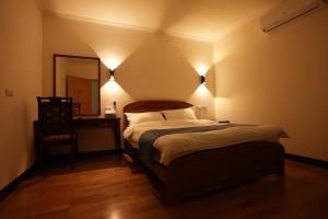 Postel nebo postele na pokoji v ubytování Lemuju B&B Hotel