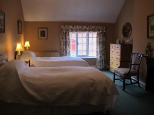 Ένα ή περισσότερα κρεβάτια σε δωμάτιο στο Cotton Farm