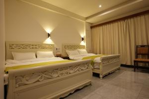 Postel nebo postele na pokoji v ubytování Lemuju B&B Hotel