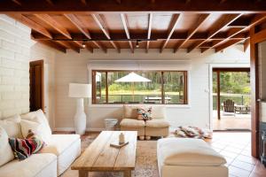 a living room with a couch and a table at Jackson Ranch by Bannisters in Bawley Point