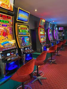 a row of slot machines in a casino at Queensport Tavern And Motel in Brisbane