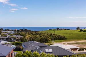 an aerial view of a town with houses and the ocean at Ocean Vista in Lakes Entrance
