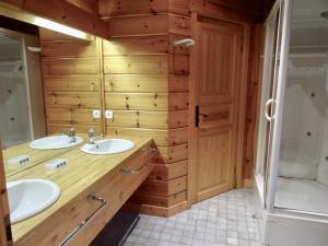 a bathroom with two sinks and a shower at Chalet spacieux 13 couchages proche pistes à Demi-Quartier - FR-1-560-36 in Demi-Quartier +13 photos