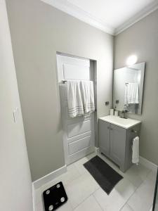 a bathroom with a sink and a mirror at SHAK Condos- Luxury, Functionality and Comfort in Saint Helena +20 photos