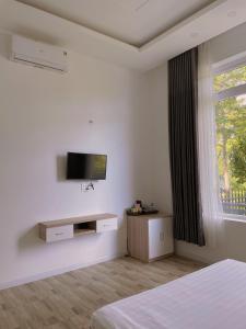 TV a/nebo společenská místnost v ubytování Homestay Tulip Garden Bảo Lộc