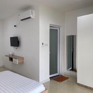 TV a/nebo společenská místnost v ubytování Homestay Tulip Garden Bảo Lộc