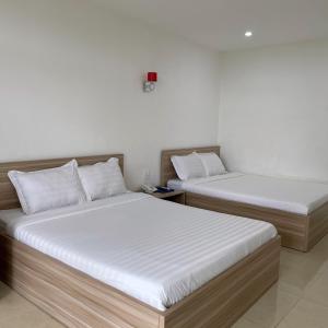 Postel nebo postele na pokoji v ubytování Homestay Tulip Garden Bảo Lộc