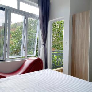 Postel nebo postele na pokoji v ubytování Homestay Tulip Garden Bảo Lộc