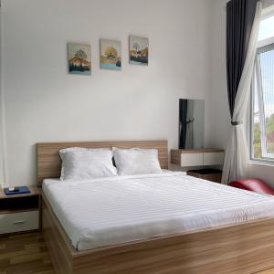 Postel nebo postele na pokoji v ubytování Homestay Tulip Garden Bảo Lộc