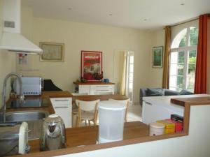 a kitchen with a sink and a counter top at Gîte paisible avec jardins privatifs à Cognac, proche des sentiers de randonnée, animaux acceptés - FR-1-653-178 in Cognac