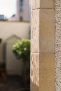 a stone pillar with a plant in the background at The Pavilion at Lamb's House in Edinburgh