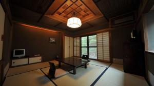 TV a/nebo společenská místnost v ubytování Yuzuya Ryokan - Adult Only
