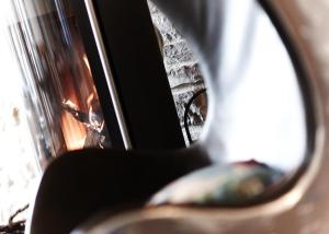 a reflection of a staircase in a rear view mirror at Hotel Café del Maar in Schalkenmehren