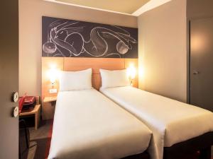 Postel nebo postele na pokoji v ubytování ibis Yerevan Center + 37 fotografií
